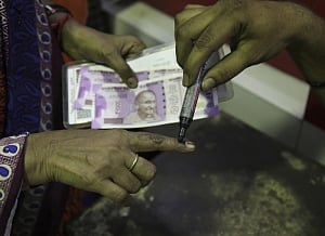 Demonetisation:Queues get shorter at banks; no respite at ATMs