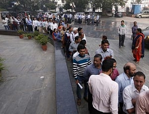long queues outside banks before weekend holiday