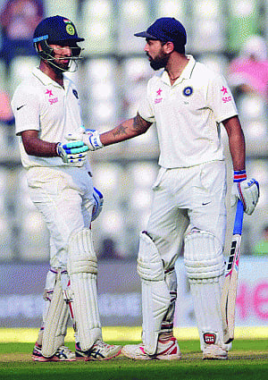 Vijay, Pujara shine for India