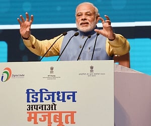 Modi launches mobile app, says your thumb your bank now