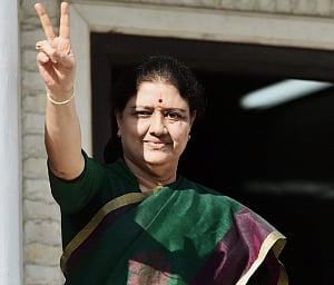 Chinnamma drapes Amma's cap