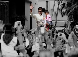 'Reluctant' Aaradhya greets Sunday well-wishers with Big B