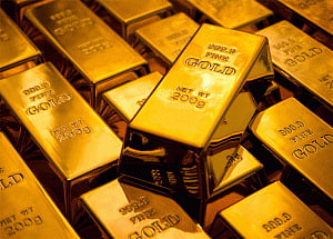 Gold slips on global cues, tepid demand