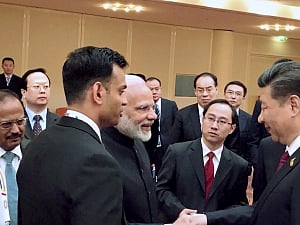 Xi shakes Modi's hand, Chinese media shows fist