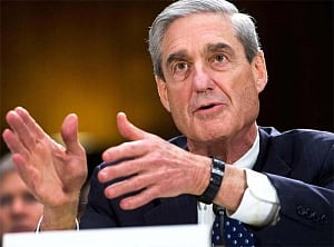With first charges, Mueller sends warning to Trump, aides
