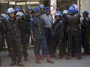 After violence, Zimbabwe awaits release of presidential vote