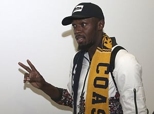 Bolt arrives in Australia on football quest