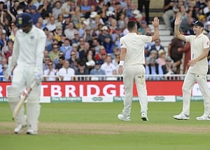 England bowl out India for 329