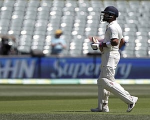 Pujara fights on but Australia still in command