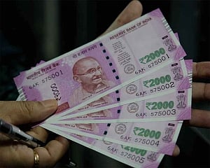 Rupee trims early gains, closes 8 paise up against US dollar