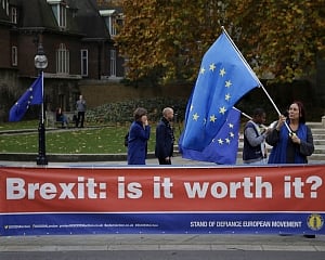 UK's May battles to save her Brexit deal and her job