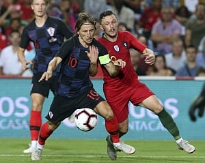 Without Ronaldo, Portugal draws with Modric's Croatia