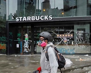2 protesters charged in 1st use of Hong Kong's new mask ban