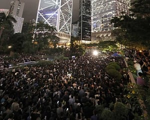 Hong Kong protesters seize roads in defiance of China warnings