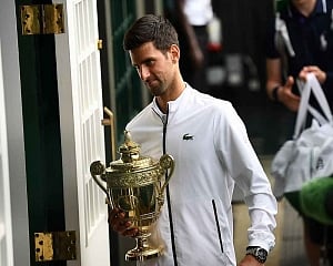 Djokovic saves match points to claim fifth Wimbledon title in record-breaking final