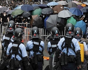 Hong Kong delays bill debate as protest crowds amass at HQ