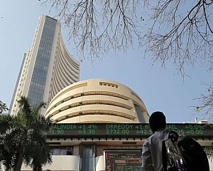 Markets end modestly lower on macro data, global cues