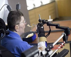 Paralysed man walks again with brain-controlled exoskeleton