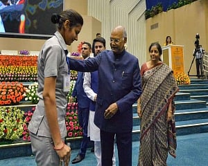 Prez attends to policewoman after award function