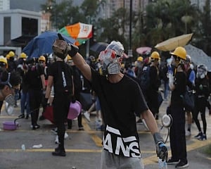 Protests disrupt Hong Kong work day as leader vows to remain