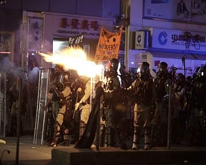 Tear gas and water cannon as crowds defy Hong Kong rally ban