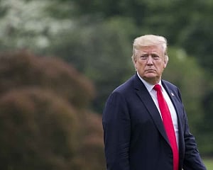 Trump delays decision on auto tariffs for up to six months