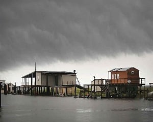 US warnings of heavy rain, tornadoes from weakening storm Barry