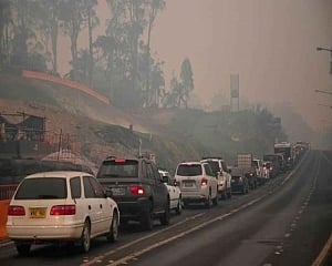 Australia orders mass evacuation of fire-ravaged towns before heatwave