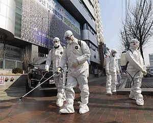 China reports 14 new coronavirus deaths; imported cases rise to 123
