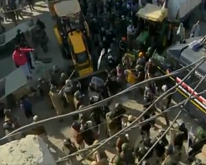 Farmers' protest: Delhi Police fire tear gas shells to disperse farmers at Singhu border