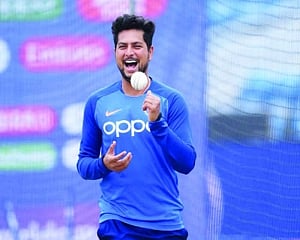 Kuldeep trying not to use saliva