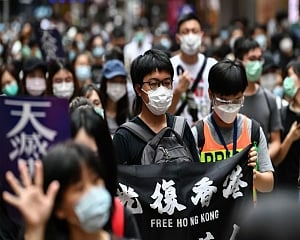 Protesters mass in Hong Kong before anthem law is debated