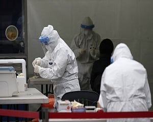 South Korea's cases, COVID-19 deaths spike again