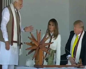 Trump, wife try spinning ''charkha'' at Sabarmati Ashram