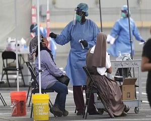 US grapples with pandemic as its origins are traced in China