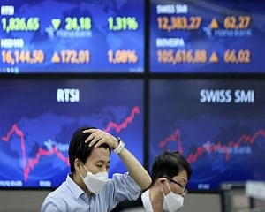 Asian shares mostly lower after fresh Wall St records