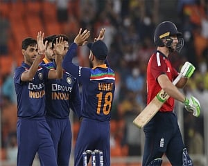 India limit England to 164/6
