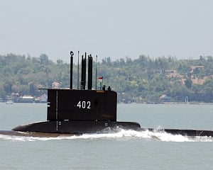 Indonesia navy finds items from lost sub, indicating it sank