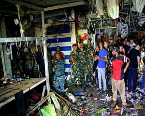 Iraqi officials: Roadside bomb kills 30 in Baghdad market