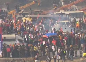 Tear gas shells fired at farmers trying to break barriers with tractors at Delhi's Mukarba Chowk