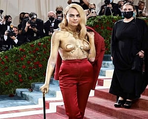 Cara Delevingne strips off to show gold-painted body on Met Gala red carpet