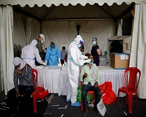 India reports over 2.35 lakh Covid cases, 871 fatalities