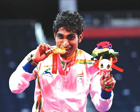 Bhagat shines with triple gold