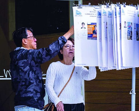 Hong Kong votes in legislative election after deadly fire