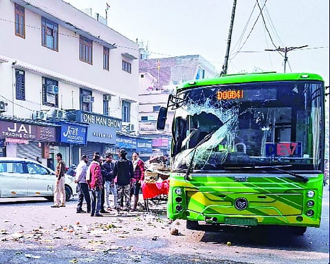 Two injured after DTC e-bus jumps divider