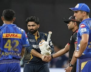 Gujarat Titans pip Mumbai Indians by three wickets in a rain-affected thriller