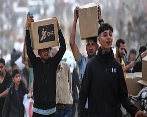 Palestinians say Israeli fire kills 5 near aid sites; Israel says fired warning shots