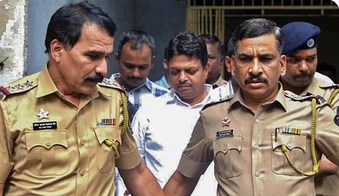 Shiv Sena corporator Ramesh Mhatre with police personnel in connection with the Thane hospital assault case. PTI image