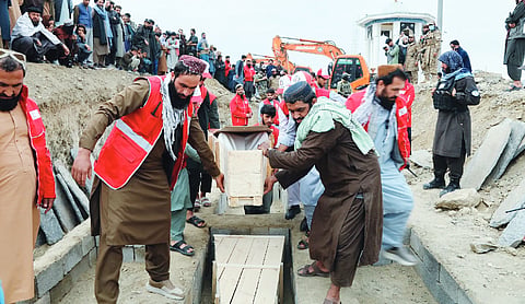 Afghans hold mass funeral for airstrike victims