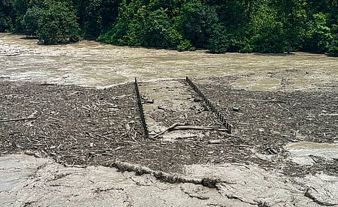 Floodwaters inundate an area. Photo source: PTI